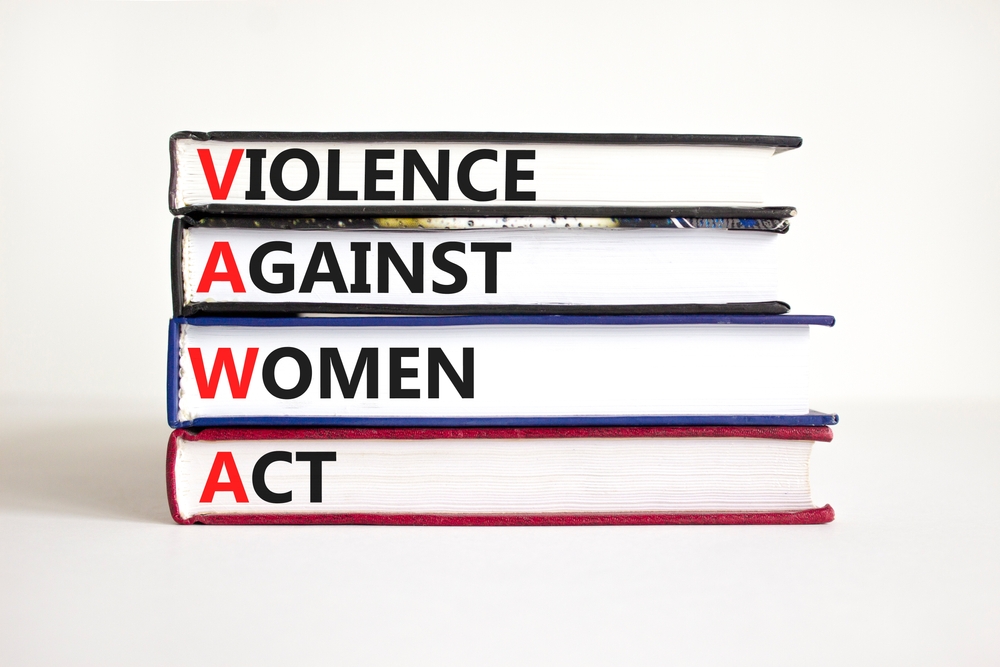 VAWA violence against women act symbol. Concept words VAWA violence against women act on books.